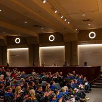 Faculty and family listening to Provost